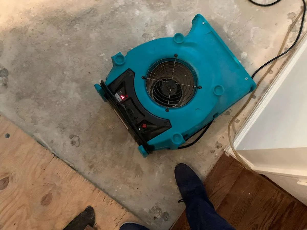 Air mover drying subfloor during Leak Detection & Repair in White Bear Lake